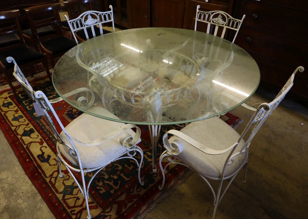 A French cast and wrought iron circular glass top garden table and four chairs, table diameter 136cm